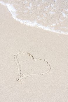 A heart symbol on the beach