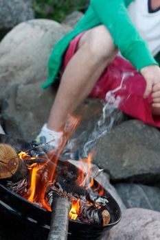 Man enjoying an outdoor fire