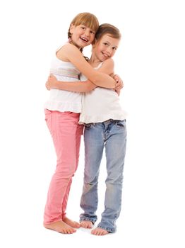 Two happy little sisters portrait isolated on white