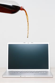 Accidentally pouring soda on a laptop