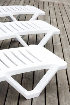 Plastic chairs by the pool