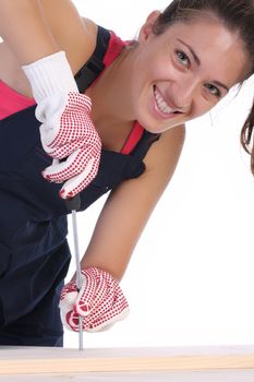 woman carpenter at work on white background 