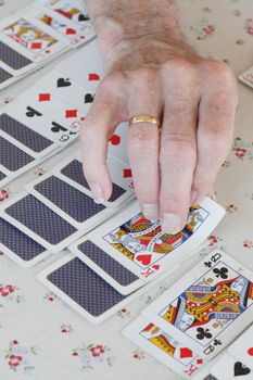 Senior playing solitaire