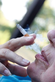 A senior woman smoking