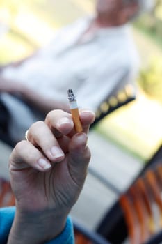 A senior woman smoking