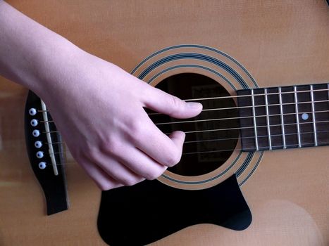 portrait of woman training on guitar playing