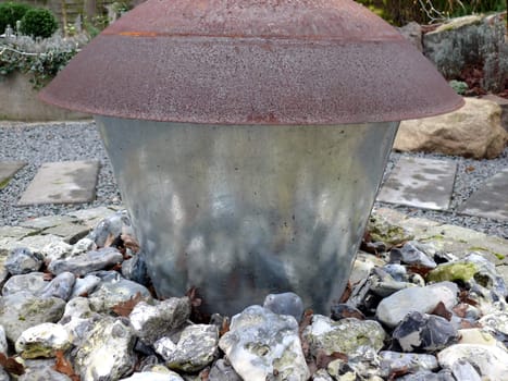 portrait of garden decoration with reflection from stones
