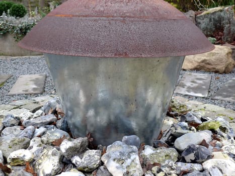 portrait of garden decoration with reflection from stones