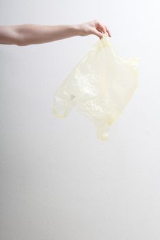 Hand holding plastic bag