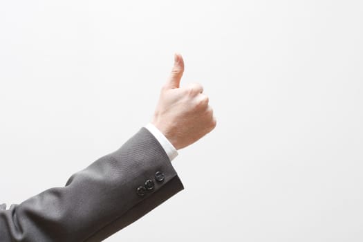 A business man signalling thumbs up