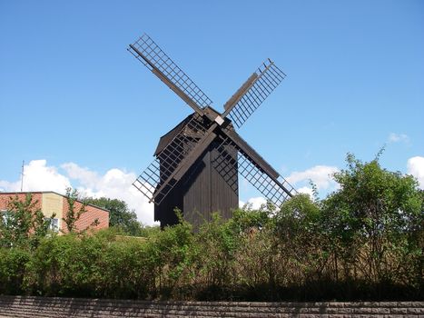 portrait of an old wind mill in the suburb