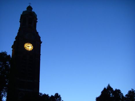 portrait of church tower blue background
