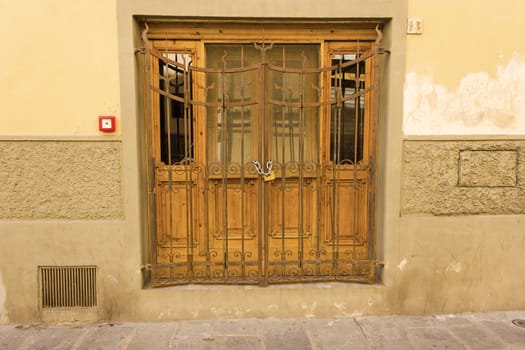 Image of antique wooden door with closed gate