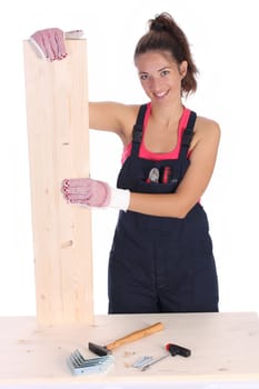 woman carpenter holding wooden plank on white background 