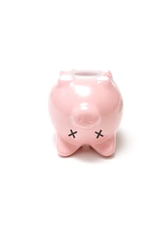 A dead piggy bank on its back