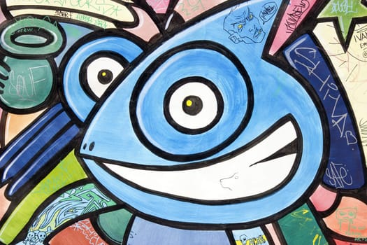 Image of an happy character face graffiti.