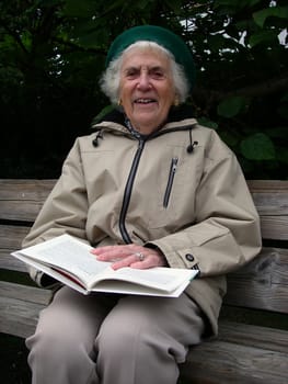 portrait of senior woman reading a book