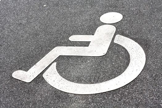 A disability logo in the road