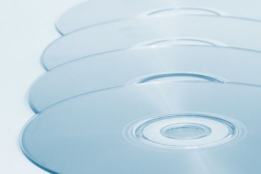 DVDs in a line with a blue hue