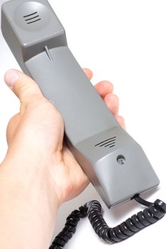 Hand holding a telephone handle