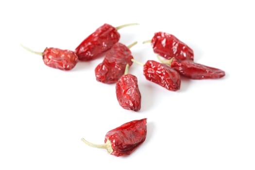 Dried red chili peppers isolated