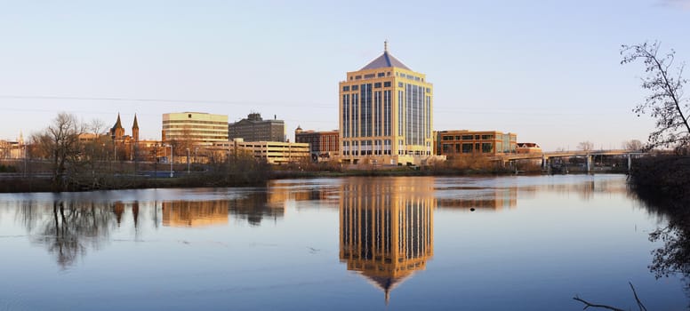 Wausau sunset panorama. Downtown of city reflected in the river.