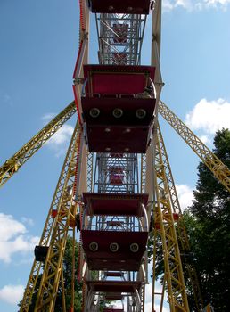 portrait of ferris wheel at amusement park