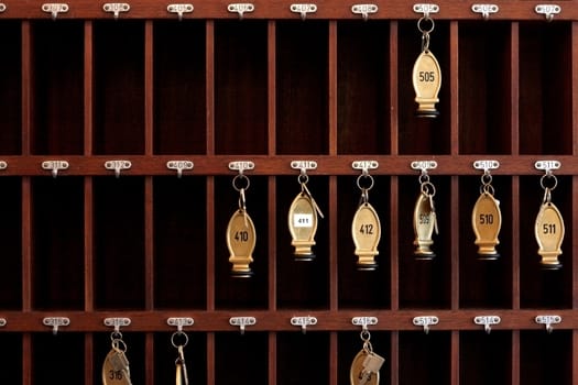 Several hotel keys in a cabinet