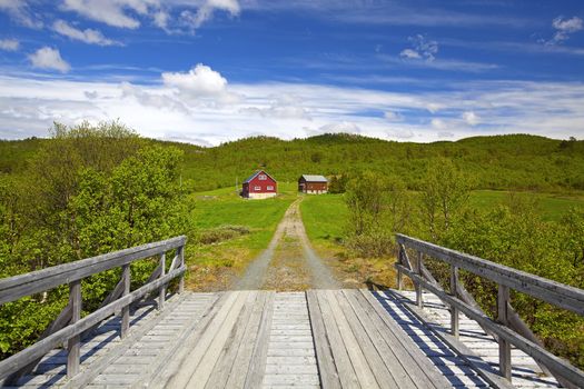 A Norwegian farm in a green summer landscape