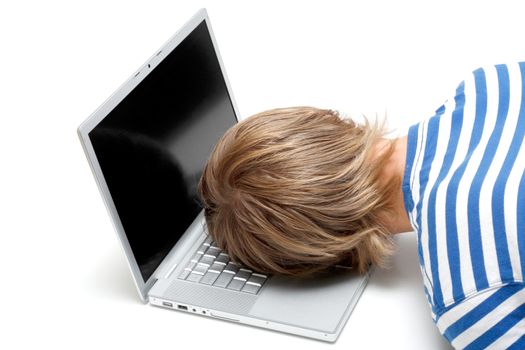 A man sleeping on his laptop