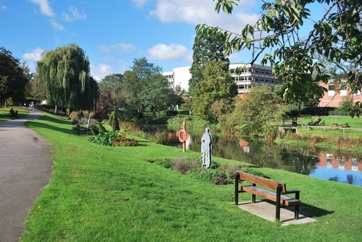 urban park with bench in foreground