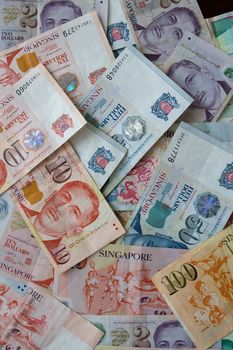 Money background from Various nominal Singapore dollars