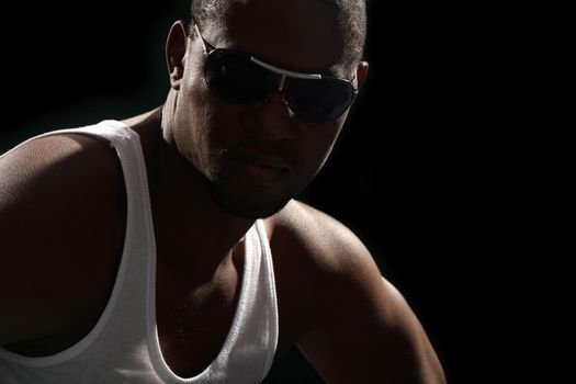 Young african american male on black background