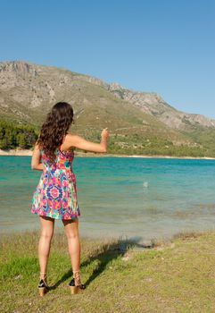 Throwing stones into and idyllic moutain lake