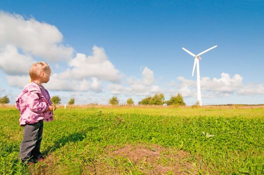 Shot of landscape with windmill and blue sky