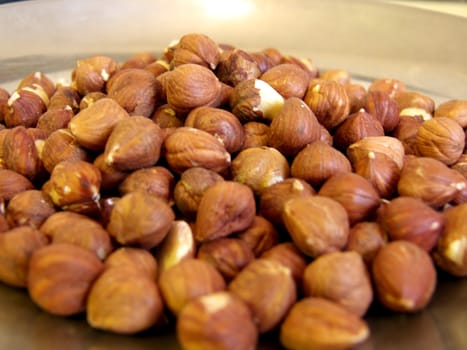 portrait of pile of peeled hazelnuts