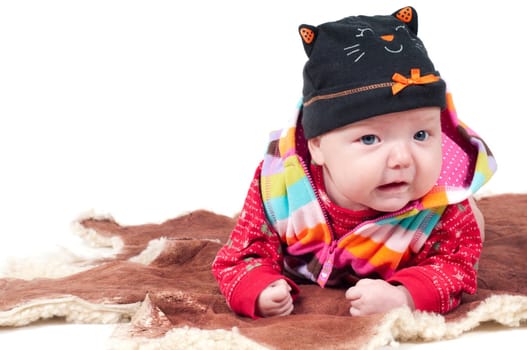 Shot of little cute baby in lying on fur