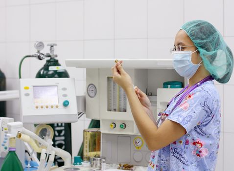 young anesthetist preparing for operation