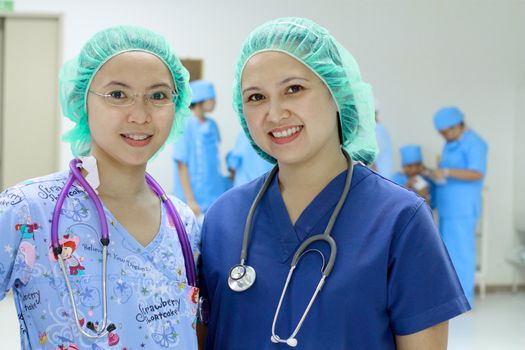 portrait of 2 asian nurses in a hospital