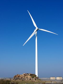 portrait of wind turbine in blue sky