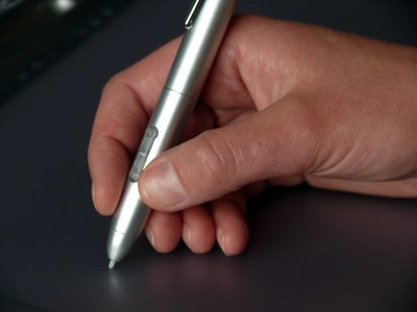 portrait of woman drawing on computer tablet