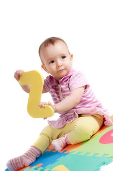 Shot of little cute baby playing with letters