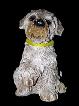 portrait of dog statue on black background