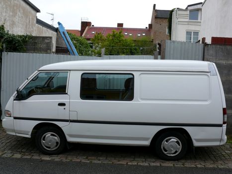 portrait of white van in the street