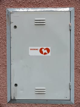 portrait of locker with a dog sign