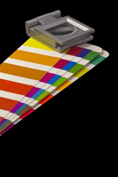 Color guide for offset print with a magnifier lens over the table