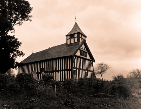 Melverley Church in Shropshire under a cloudy sky in old-fashioned treatment