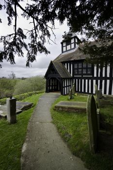 Melverley Church in Shropshire under a cloudy sky