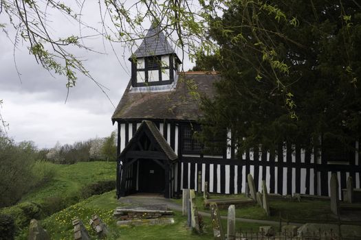 Melverley Church in Shropshire under a cloudy sky