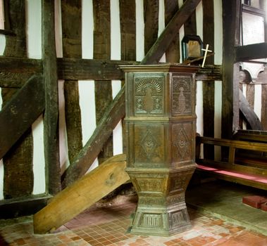Close up of a church pulpit in an old half timbered church in Melverley Shropshire